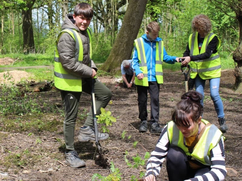 Pupils taking part in a tree planting day